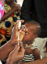 Young Gambian child waiting to be immunized with MenAfriVac