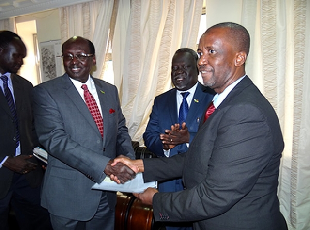 Dr. Usman presents letter of credence to the Minister of Foreign Affairs, Hon. Dr. Benjamin Barnaba while the Minister of Health applauds