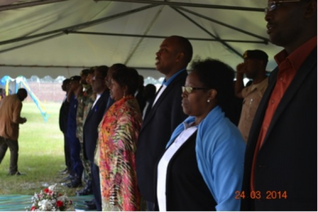 Meeting participants including (right to left) Dr. Julie Mugabekazi (WHO), Mayor of Nyanza district and Hon.Minister Dr. Agnes Binagwaho sing the national anthem to kickstart World TB day event Sheila Mburu / WHO