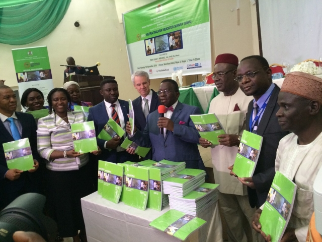 Minister of Health (with microphone) flanked by dignitaries at the MIS launch