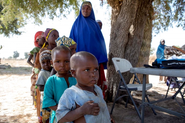 Children queuing for meningitis vaccination