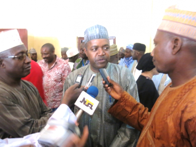 Dr Pascal Mkanda answering questions from journalists outside the palace