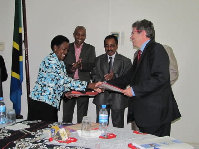 The Head of Operations in the Delegation of the European Union in Tanzania, Mr Eric Beaume, exchanging the signed memorandum of understanding with the Permanent Secretary for Ministry of Health and Social Welfare, Ms. Regina Kikuli during the ceremony.