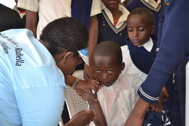 Young student gets the MR vaccination at the national launch in Narok County