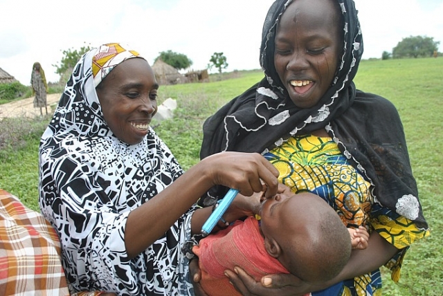 SCDDs personnel immunizing a child