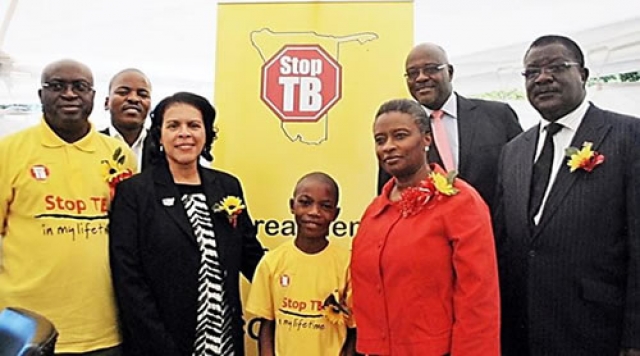 WHO Representative, Dr Magda Robalo, US Ambassador Ms Wanda Nesbit, Khomas Regional Governor, Mr Samuel Nuuyoma, Permanent Secretary, Ministry of Health and Social Services Mr Kahuure, Khomas Regional Director Mr Taapopi at the World TB commemoration pose with 12 years old TB patient, Petrus Dumeni who was diagnosed and successfully completed TB treatment