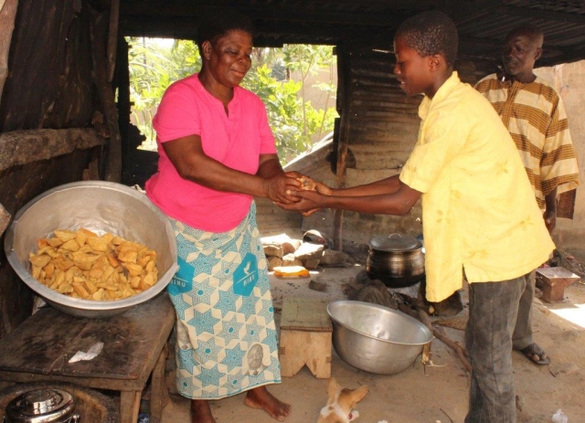 Madam Kamazoue Abatan, food vendor. She is a beneficiary of early diagnosis and prompt treatment.