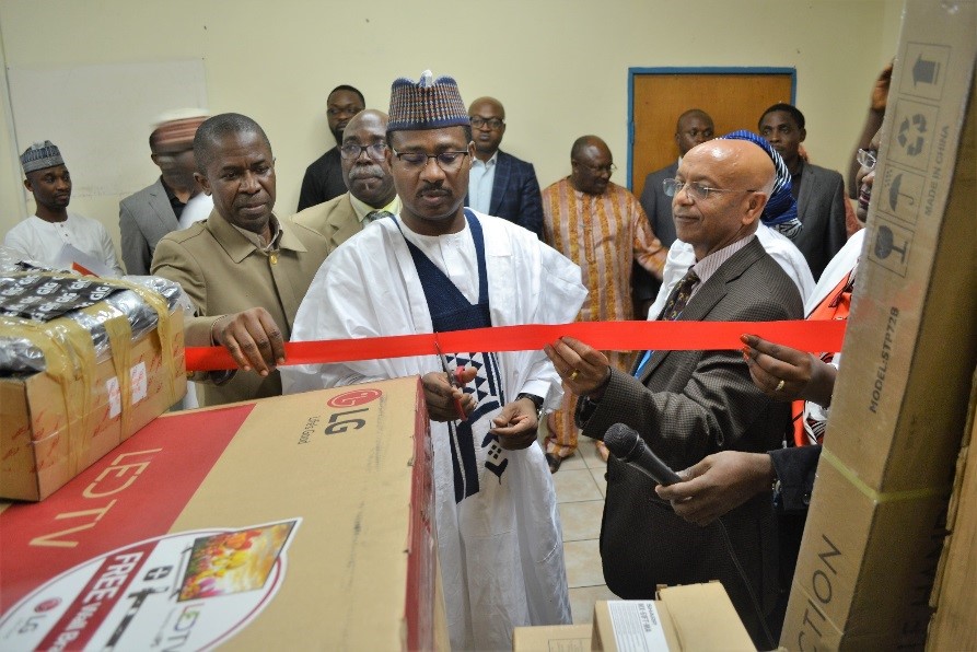 The ED cutting the tape to formally receive the equipment for NERICC