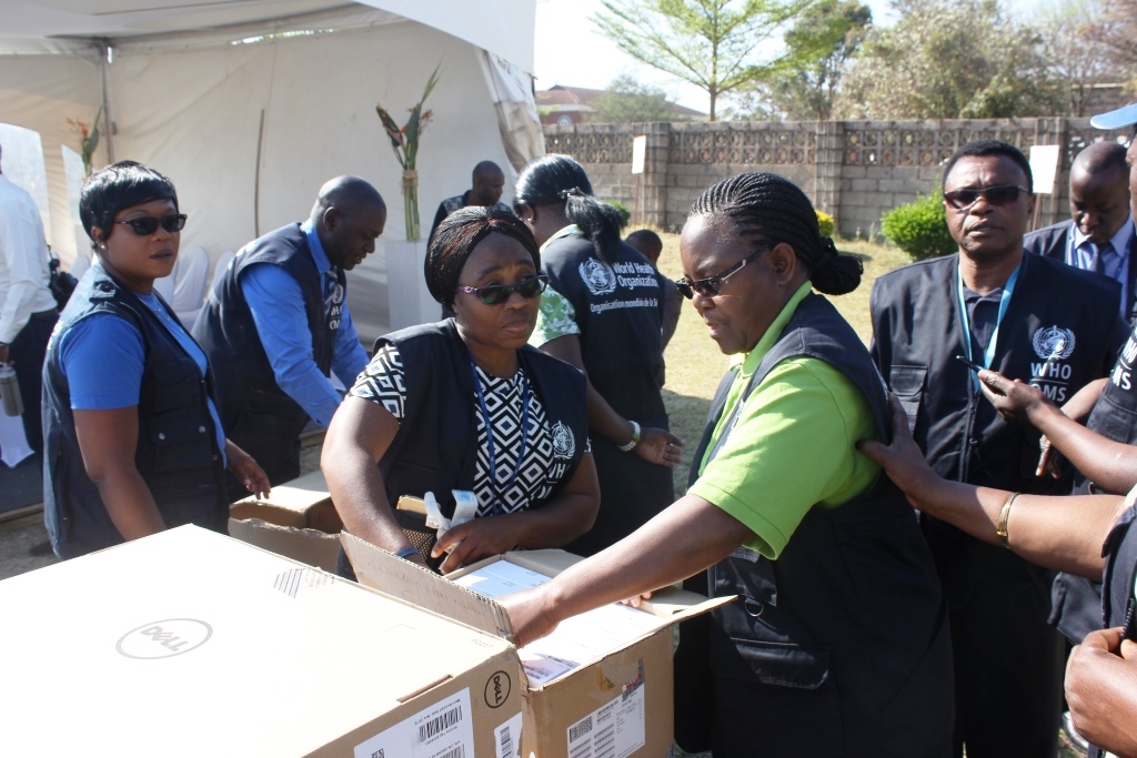 WHO staff in action at the hand over ceremony