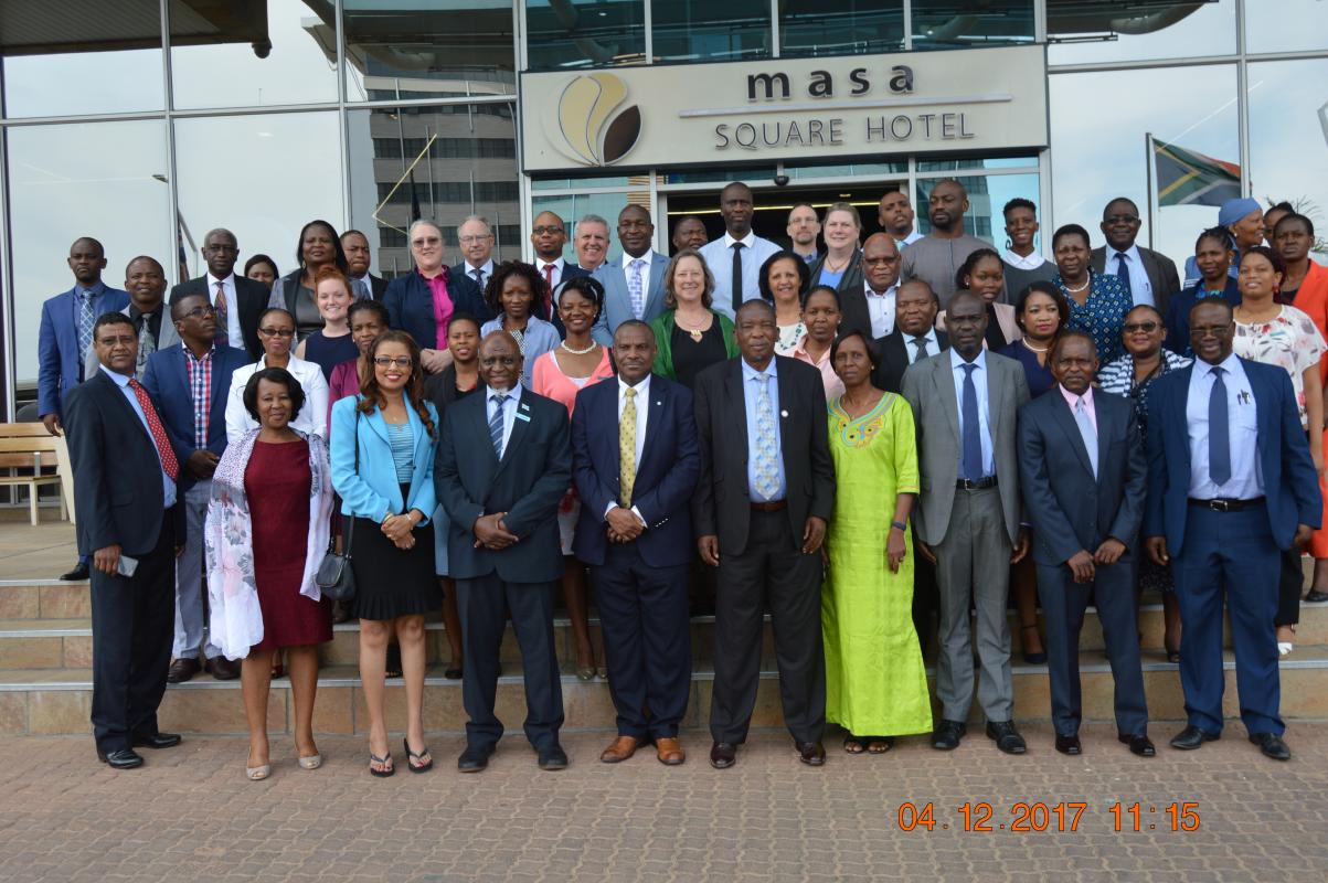 Joint internal and external evaluation team posing for a group photo