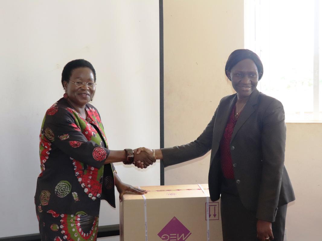 OIC Zimbabwe, Dr Juliet Nabyonga handing over the kits to Dr Portia Manangazira, Director Epidemiolgy and Disease Control in Ministry of Health and Child Care