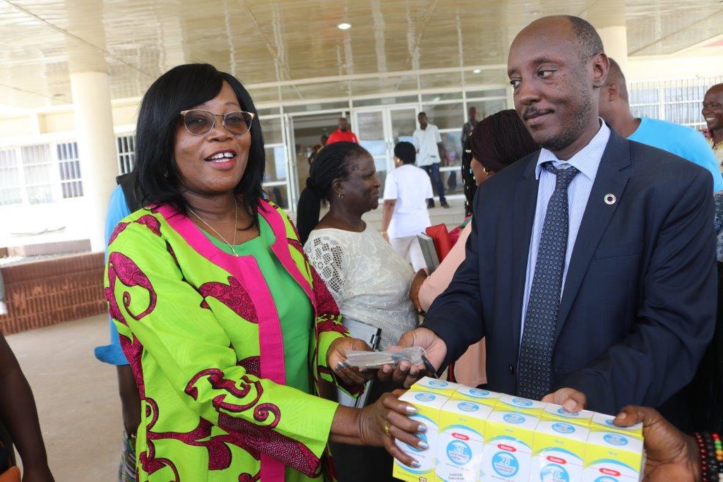 WHO Representative Dr. Alex Gasasira handing over key of the ambulance and BB lotions to the Hon. Minister of Health Dr. Wilhelmina Jallah