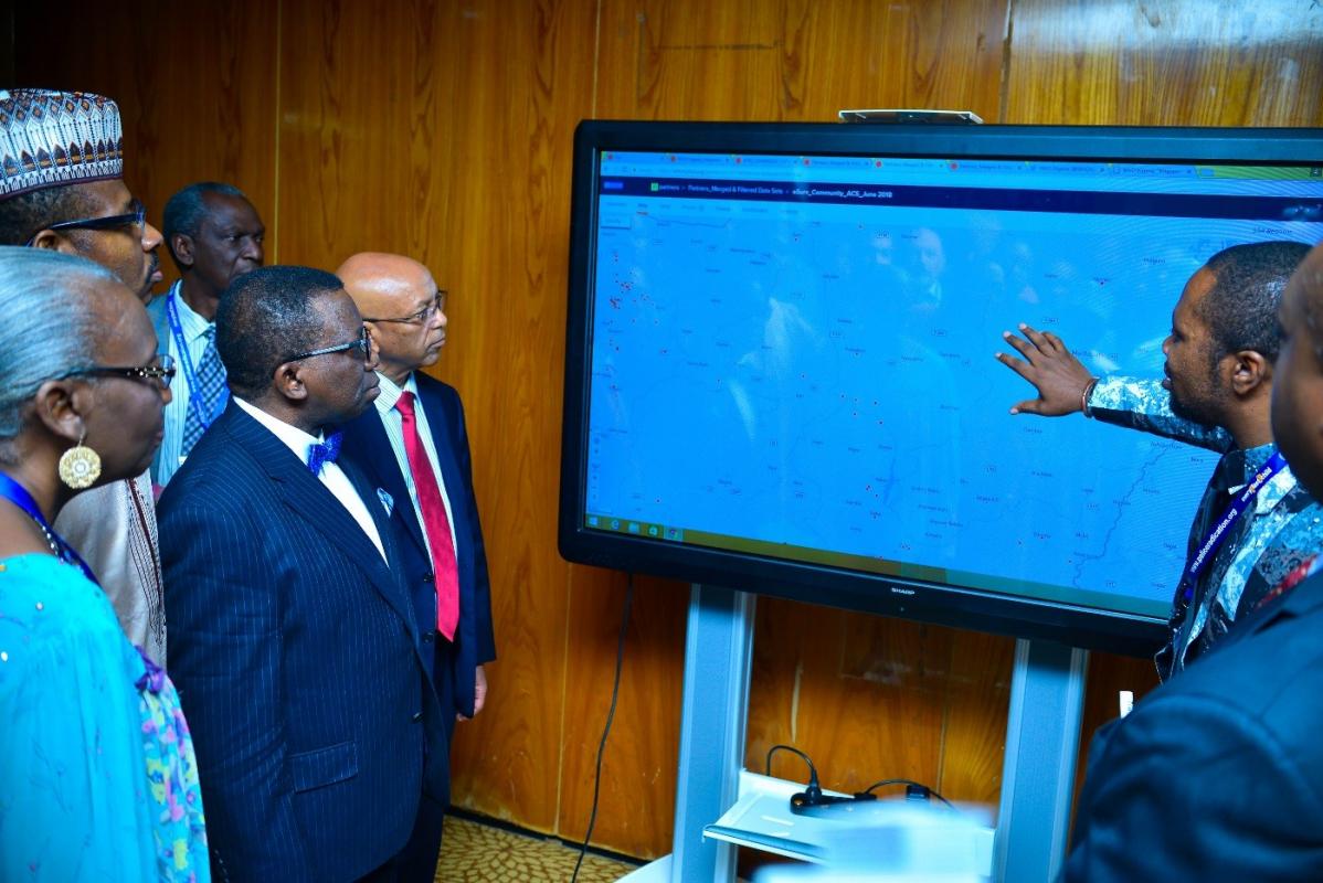 L-R Prof. Rose Leke, ARCC Chair, Dr Faisal Shuaib the ED of NPHCDA, Professor Isaac Adewole, Nigeria’s Minister of Health and Dr Alemu, WHO country Representative appreciating e-Surve in Abuja