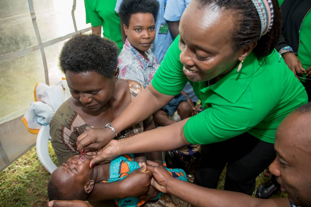 Minister of Health, Dr Diane Gashumba, administering vitamin A in the launching ceremony of MCH Week