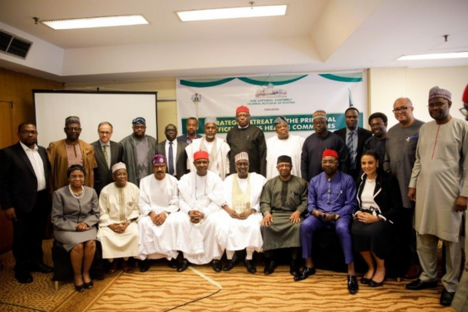 Minister of Health (seated 3rd right), Convener and  Senate Committee Chairman on Health (seated 4th  Right) at the retreat in Abuja