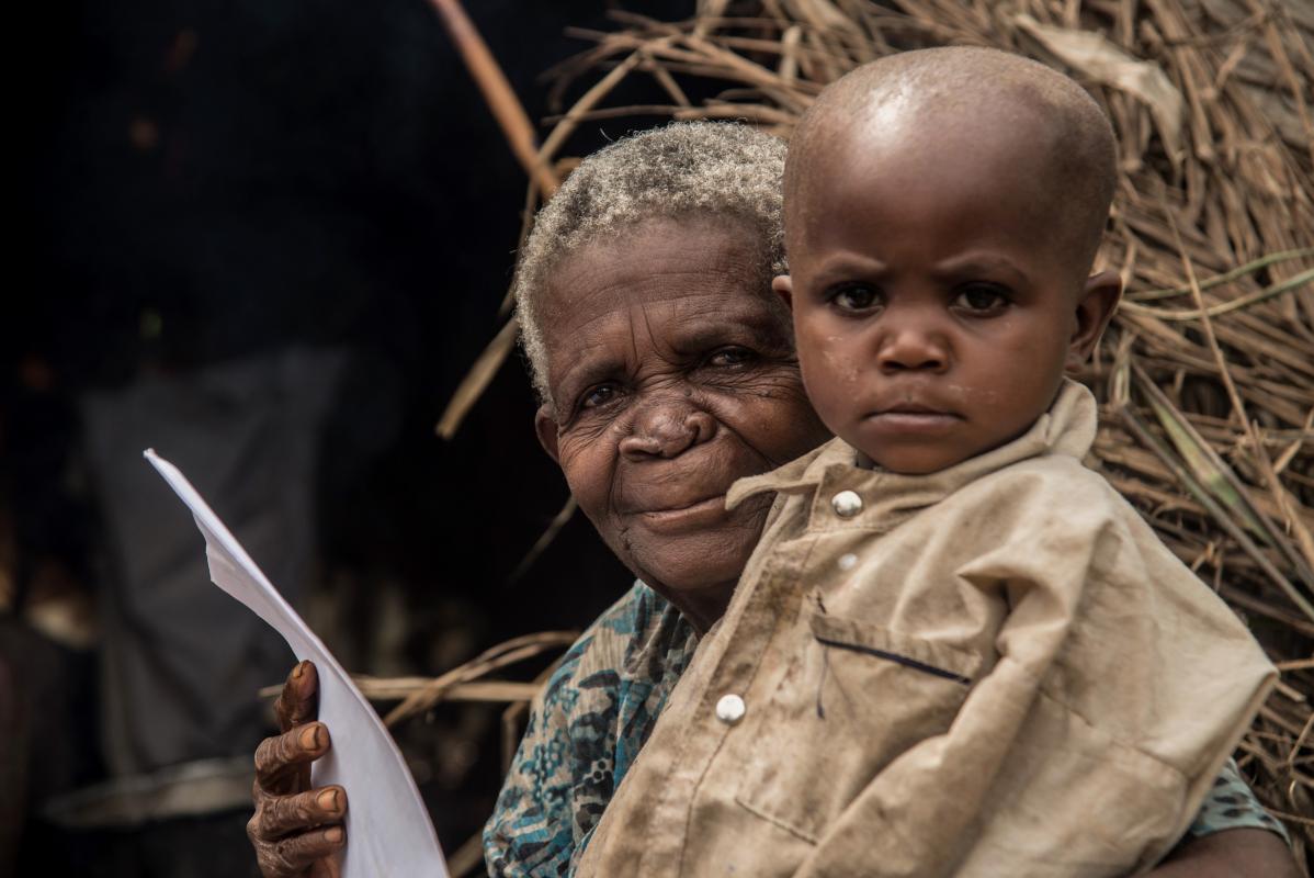 Esther Mugenyi with her vaccination certificate