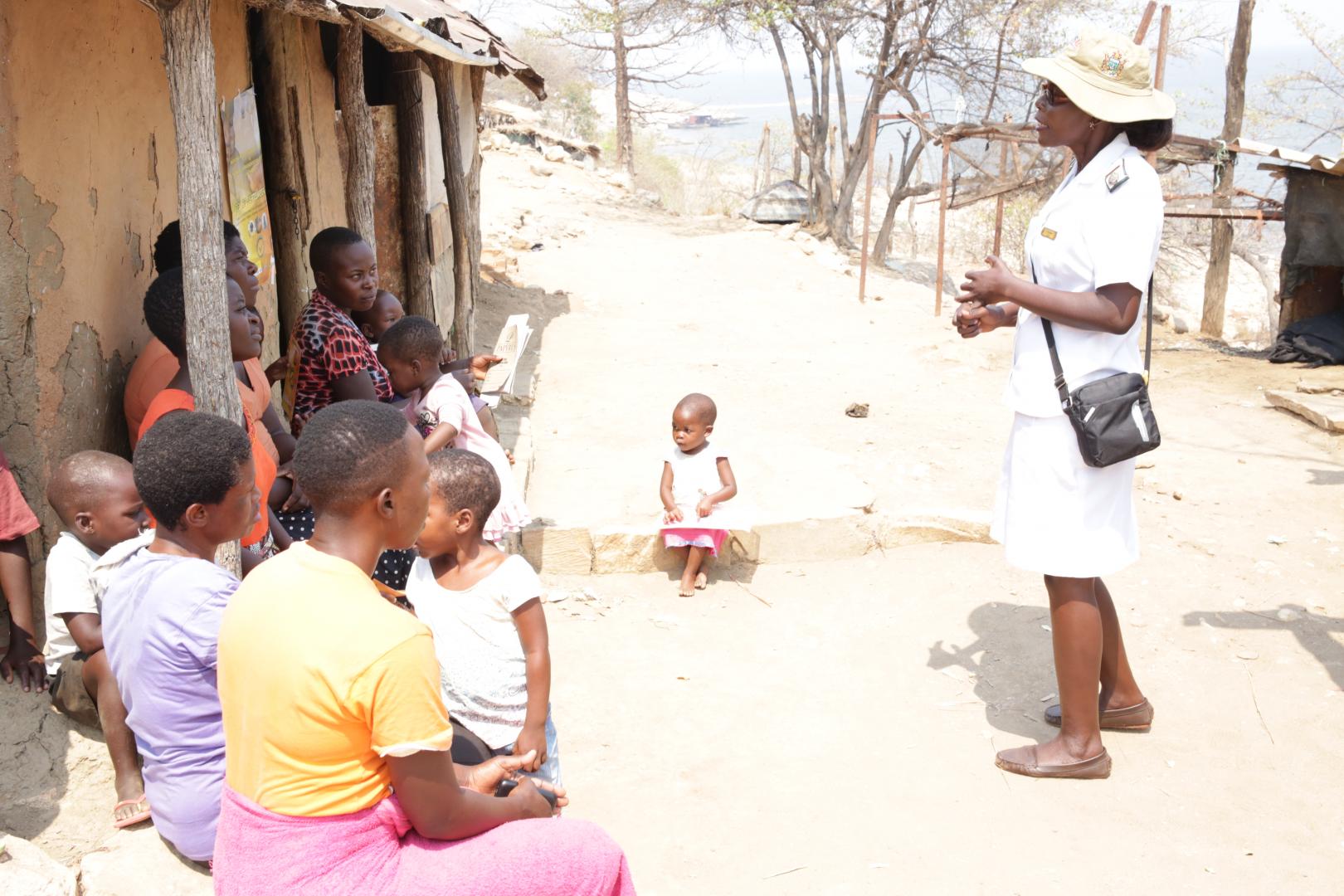 Health care worker explaining to women about post abortion care services available at health centres