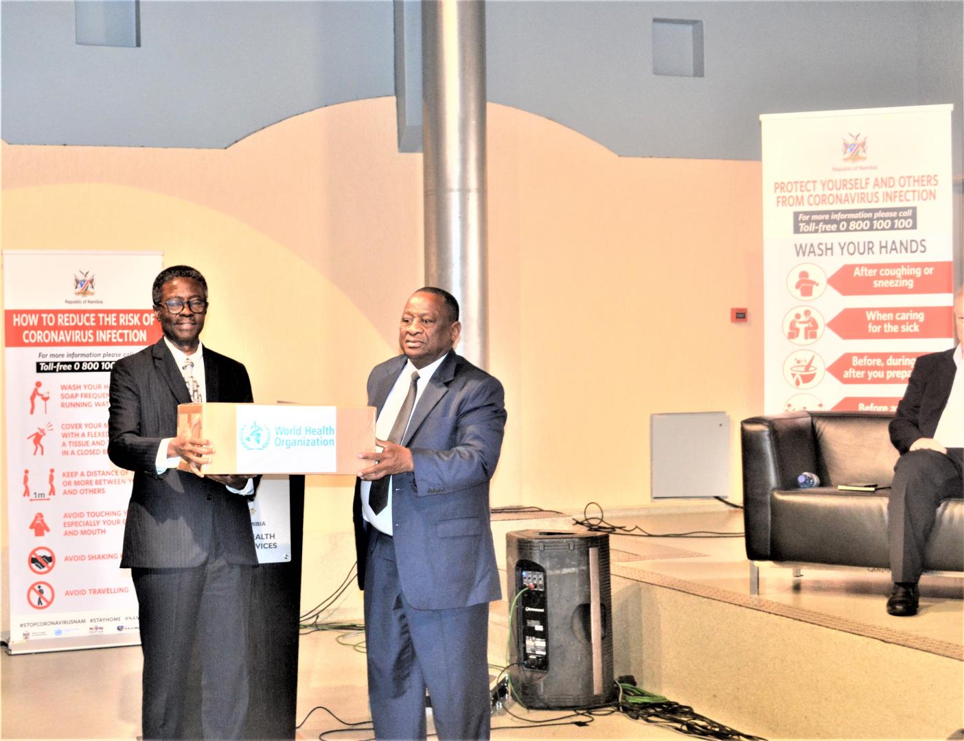 WHO Representative to Namibia, Dr Charles Sagoe-Moses handing over the COVID-19 medical supplies to the Minister of Health and Social Services, Dr Kalumbi Shangula 