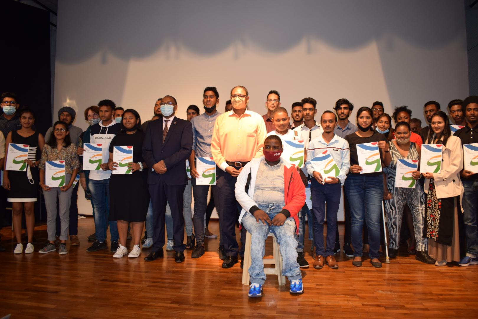 Group photo: Dr L. Musango, WHO Representative in Mauritius and Hon Mr S. Toussaint, Minister of Youth Empowerment, Sports and Recreation (in the centre) with the participants of the National Info Clip Competition