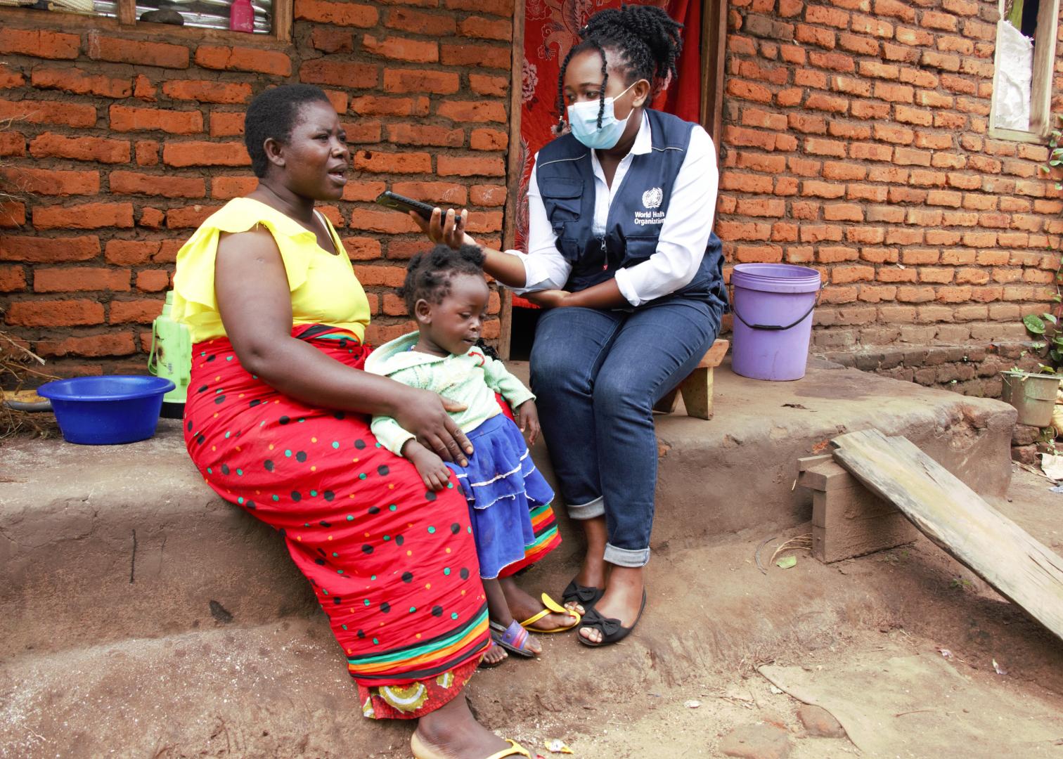 Clara Magalasi, from rural Lilongwe, Malawi, walked 4 kilometers to ensure her daughter Grace, age 22 months, received her 4th and final dose of the malaria vaccine – the 4-dose regimen provides optimal malaria prevention benefits as a complementary malaria control tool.