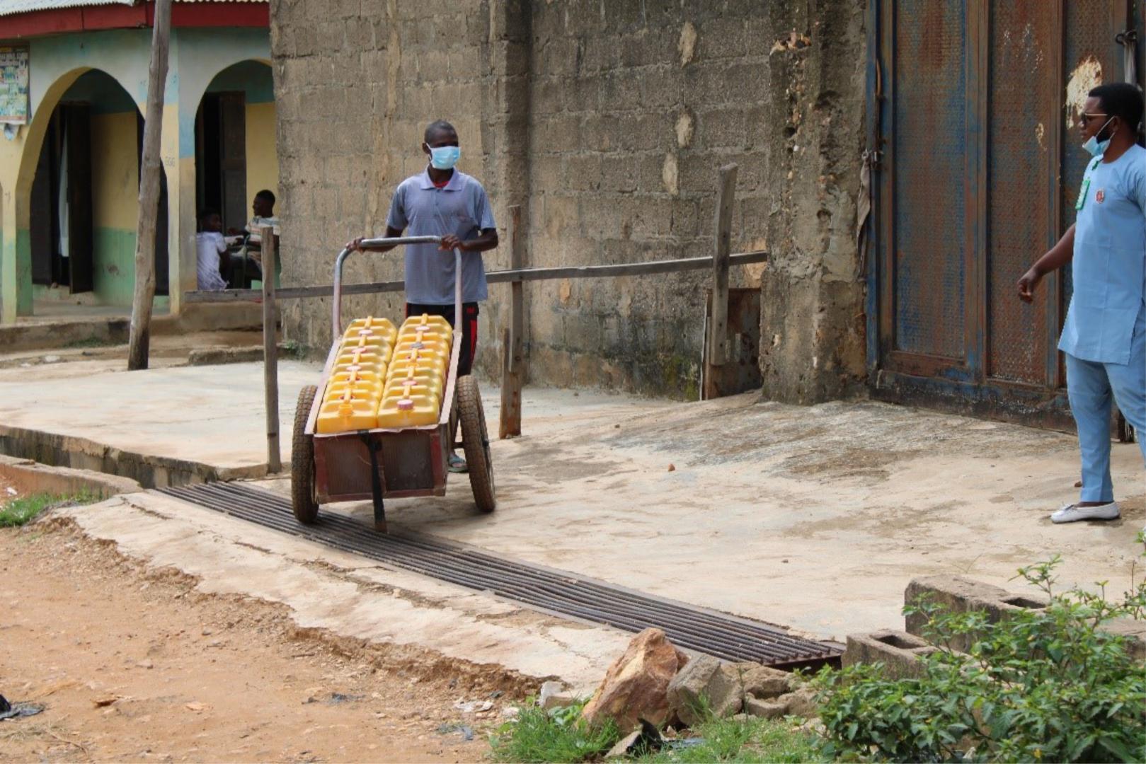 L-R Isah Alilu, a water vendor with Abubakar Mohammed, a community youth sanitation volunteer at Tudun Wada North, Niger State