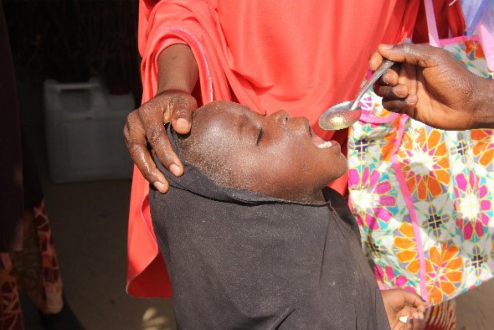 An eligible child being administered with Seasonal Malaria drug. Photo_credit_Kingsley_WHO