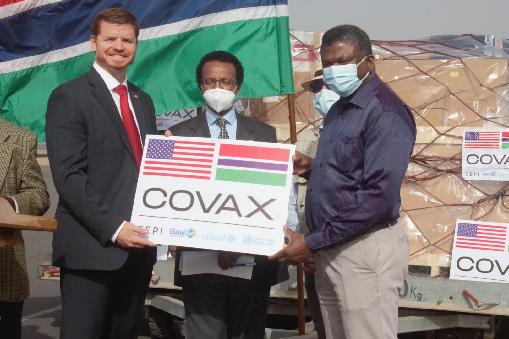 The Deputy Chief of Mission at the United States Embassy in the Gambia, Mr Jason Willis official handing over the vaccines to the Hon. Minister for Health, Dr. Ahmadou Lamin Samateh