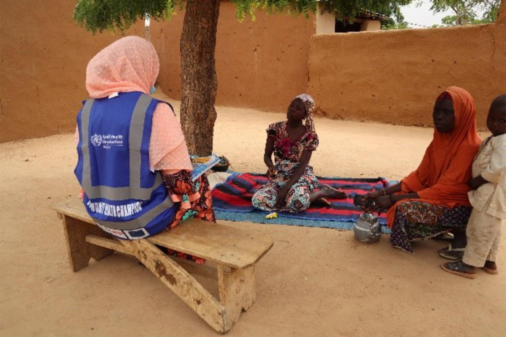 Community Health Champion provide health risk messaging in hotspot locations. Photo-credit_ Kingsley_WHO