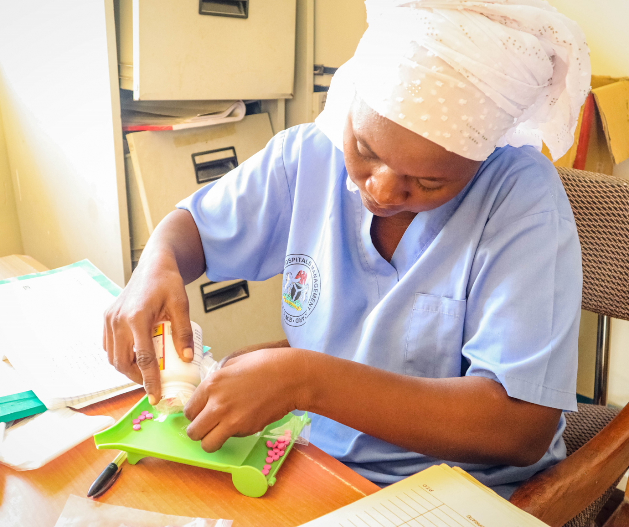 A Mental health nurse prescribing drug to a patient at PHC Mala-Kachallah during the consultation. Photo credit: Kingsley Igwebuike/WHO