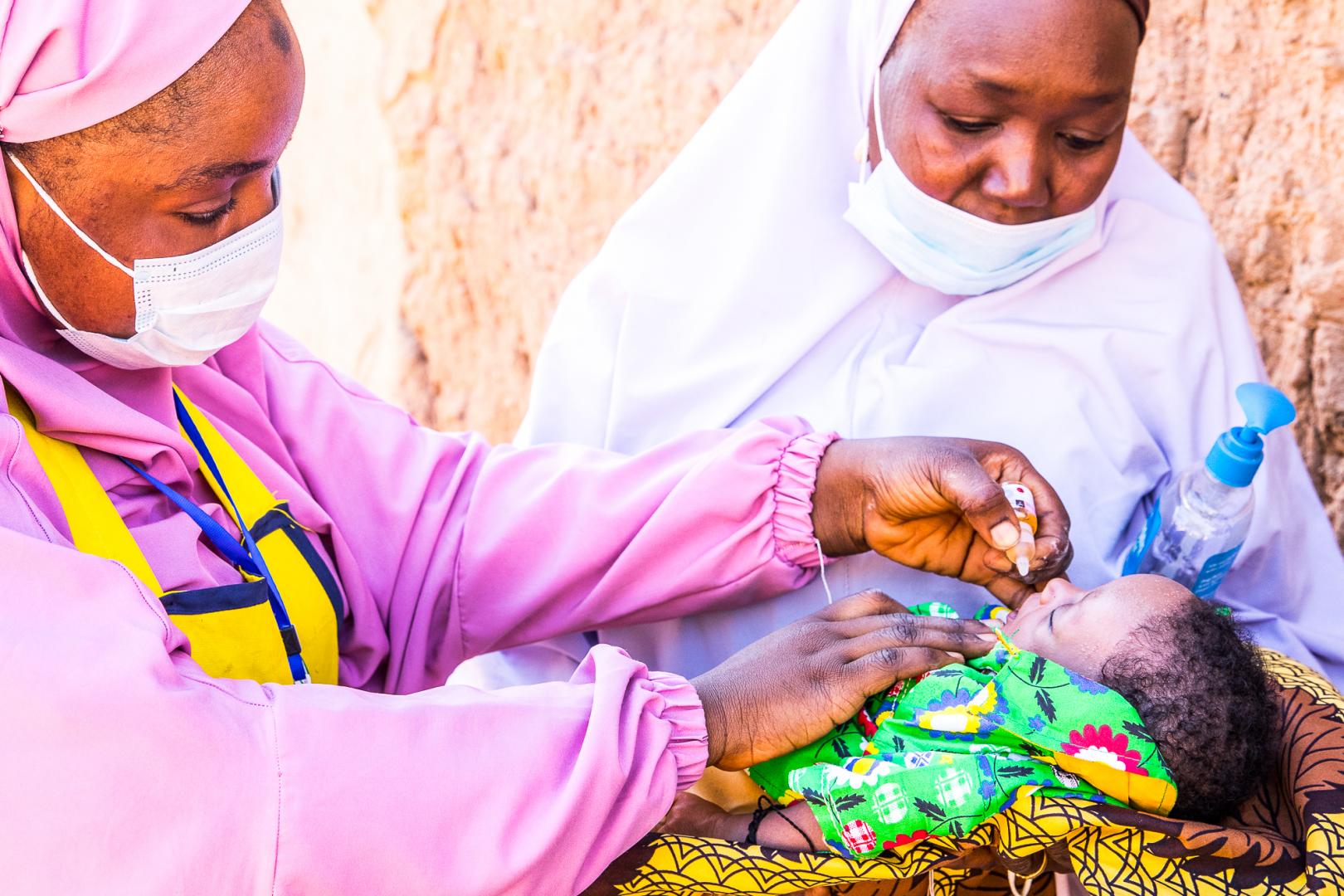  Child being vaccinated with oral polio vaccine