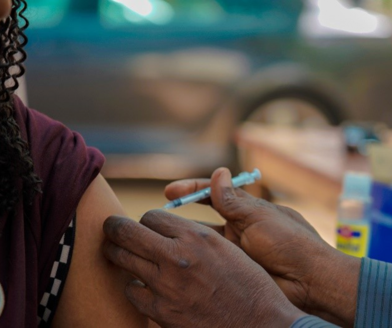 A woman receiving the COVID-19 vaccine in Abuja