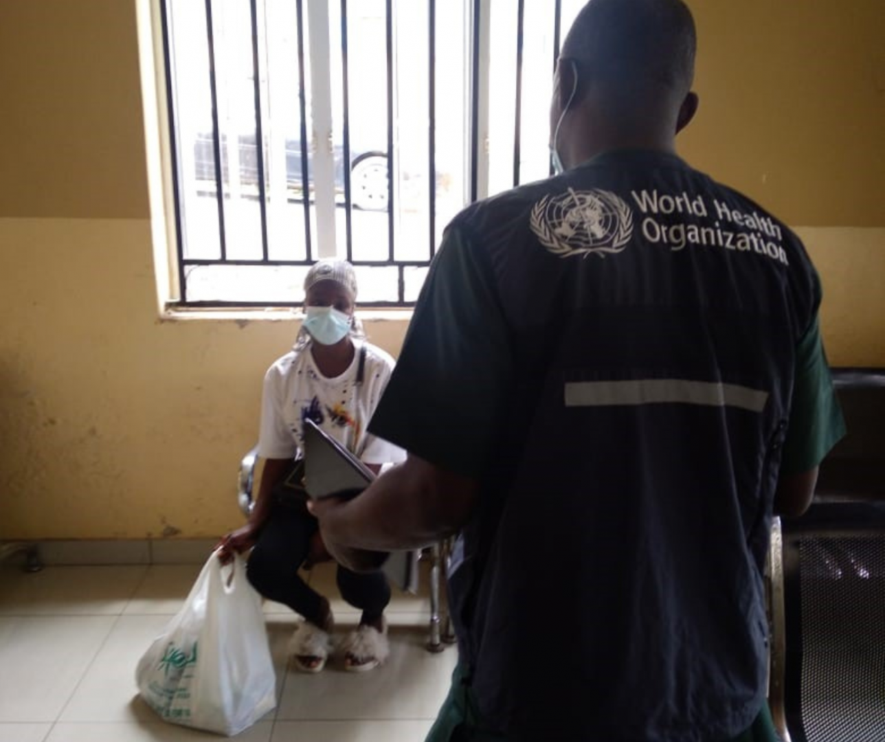 WHO personnel counselling a TB Patient