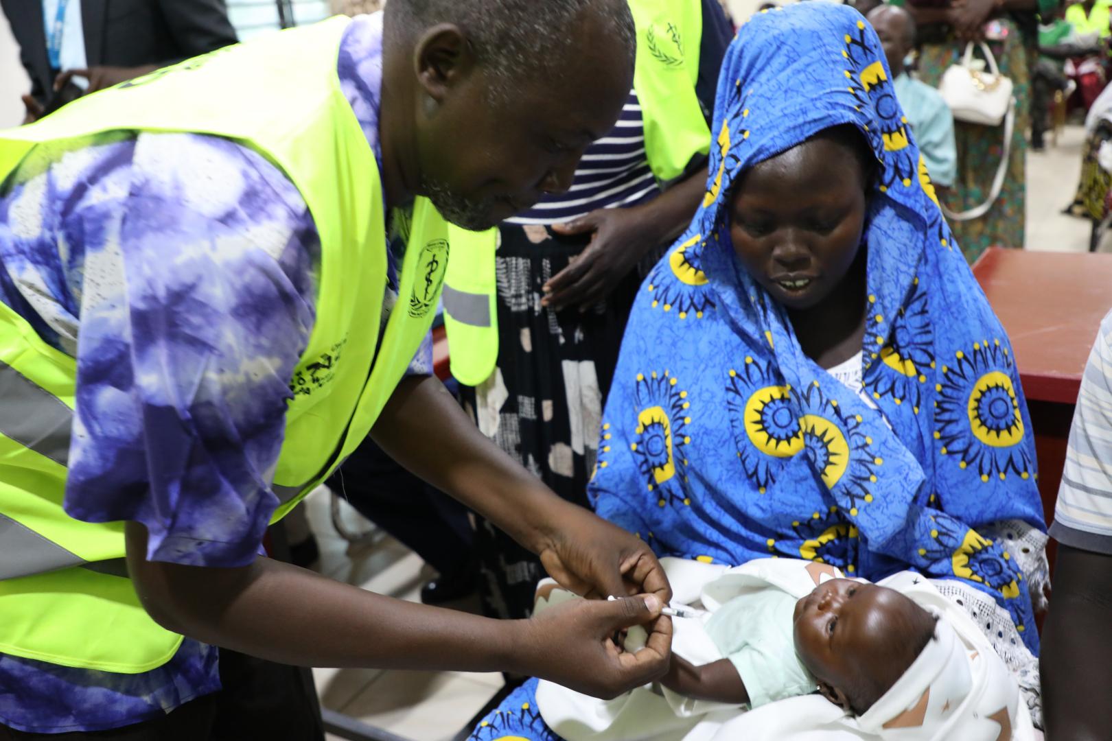 A health worker administering measles vaccine at Al-Sabah Children's Hospital in Juba 