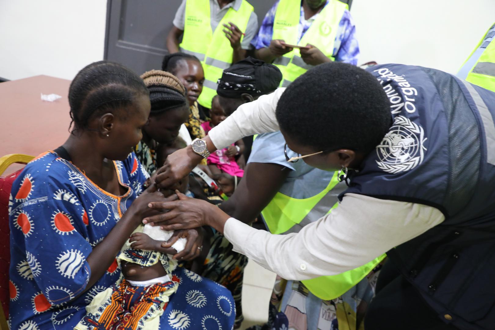 Dr Mutale Senkwe of WHO administering vitamin A during the African Vaccination Week Celebration