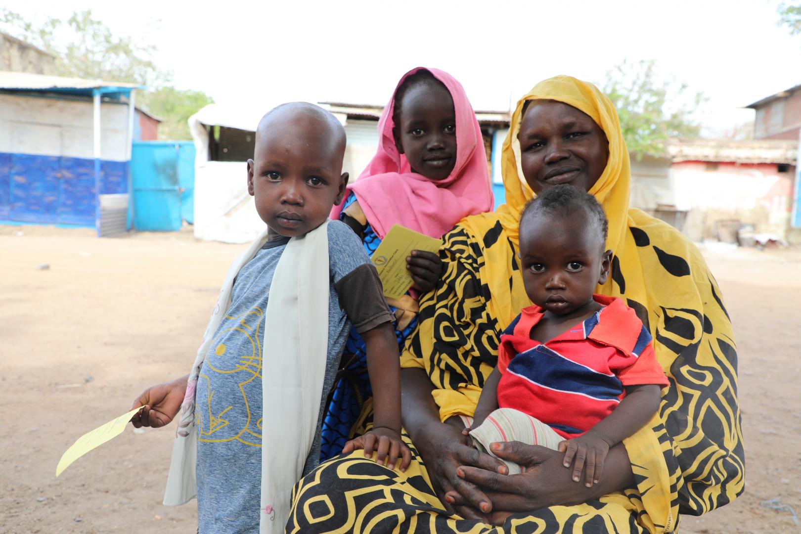 Nyatuka Othow and her children received oral cholera vaccine 