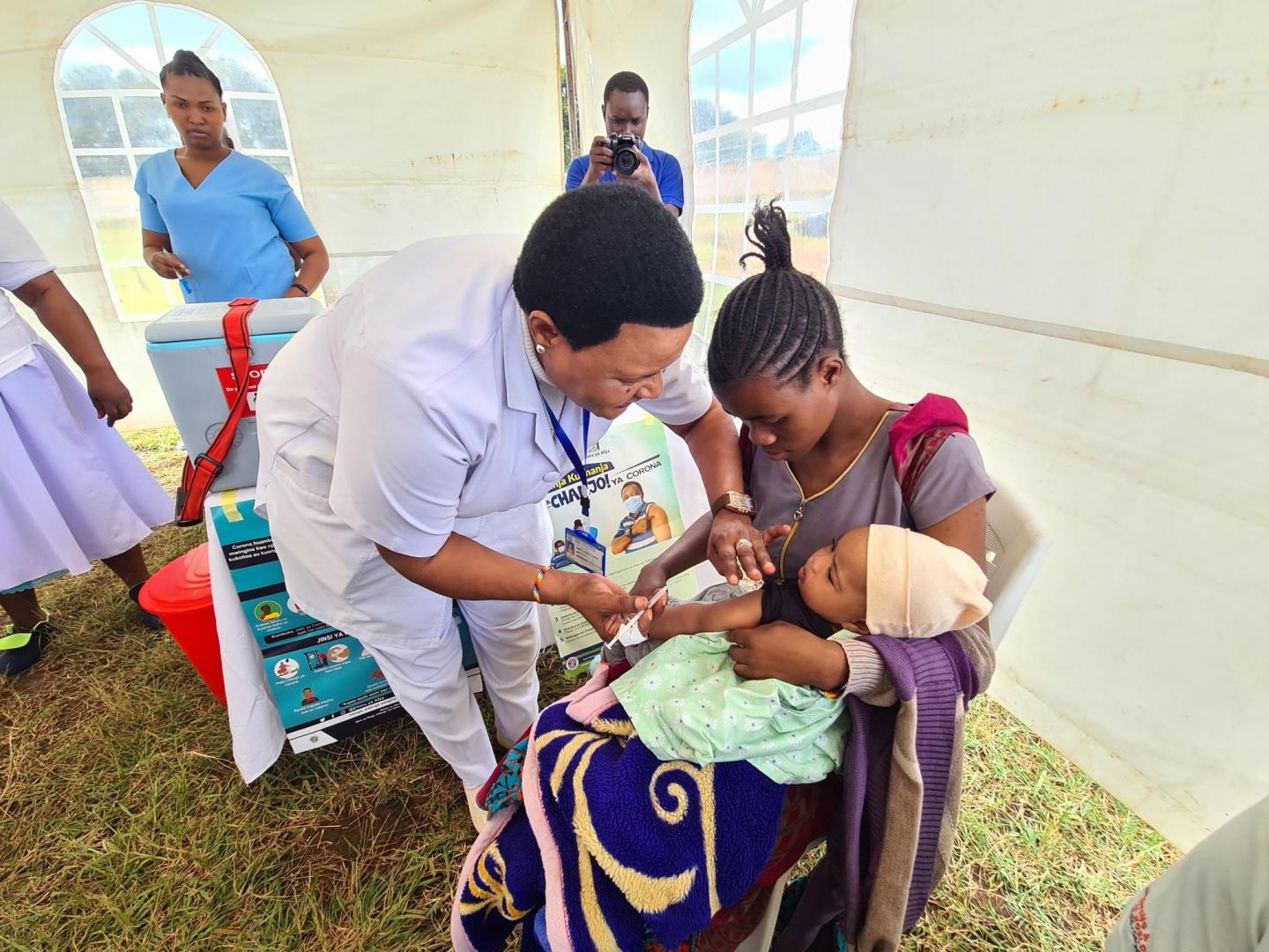 A child receiving routine vaccination during the event 