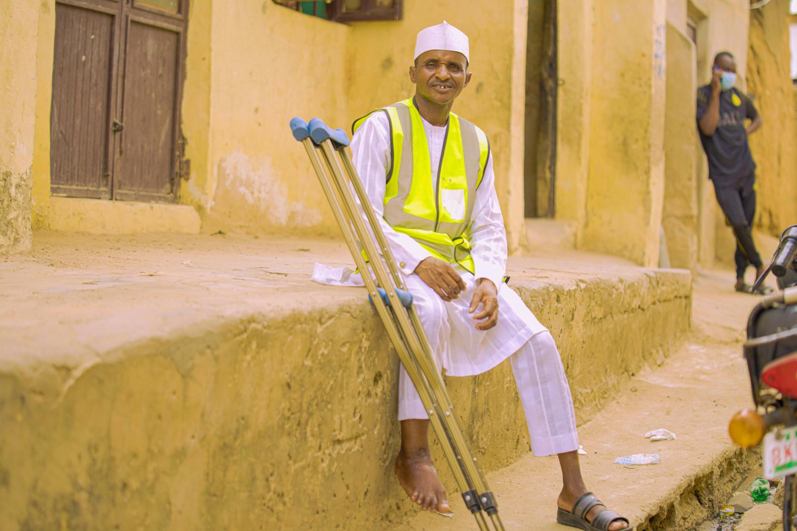 A polio survivor, Ibrahim Mohammed in the field mobilizing support for polio vaccination