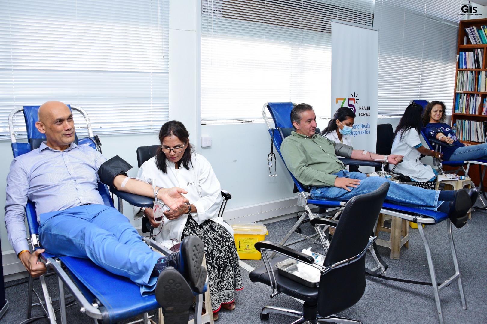 The Honorable Minister of Health and Wellness, Dr Kailesh Kumar Singh Jagutpal;His Excellency the High Commissioner of the Islamic Republic of Pakistan, Mr Muhammad Arshad Jan Pathan and WHO Representative, Dr Anne Ancia donating blood at WHO Mauritius  