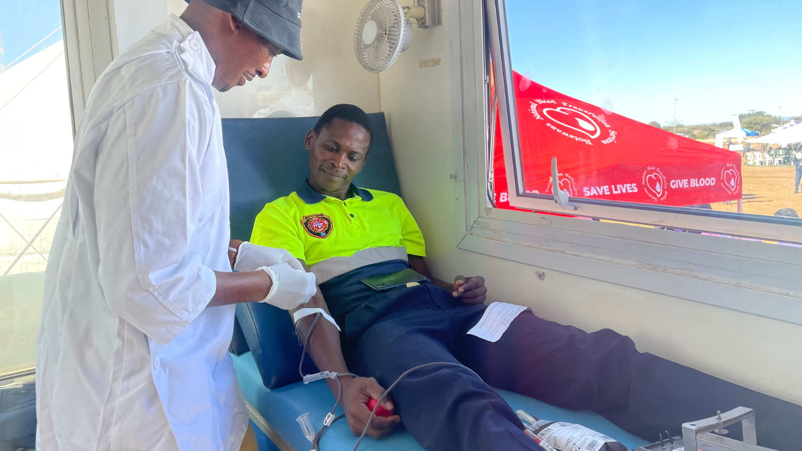 Blood donors donate blood at the World Blood Donor Day commemoration in Serowe
