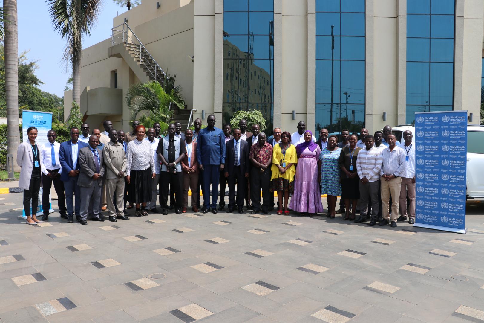 MoH and WHO staff posing for a group photo