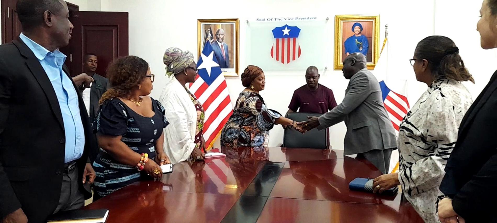 Hon VP, Chief Dr. Jewel Howard Taylor greets WHO Country Representative during the launch of the WBFW in Liberia