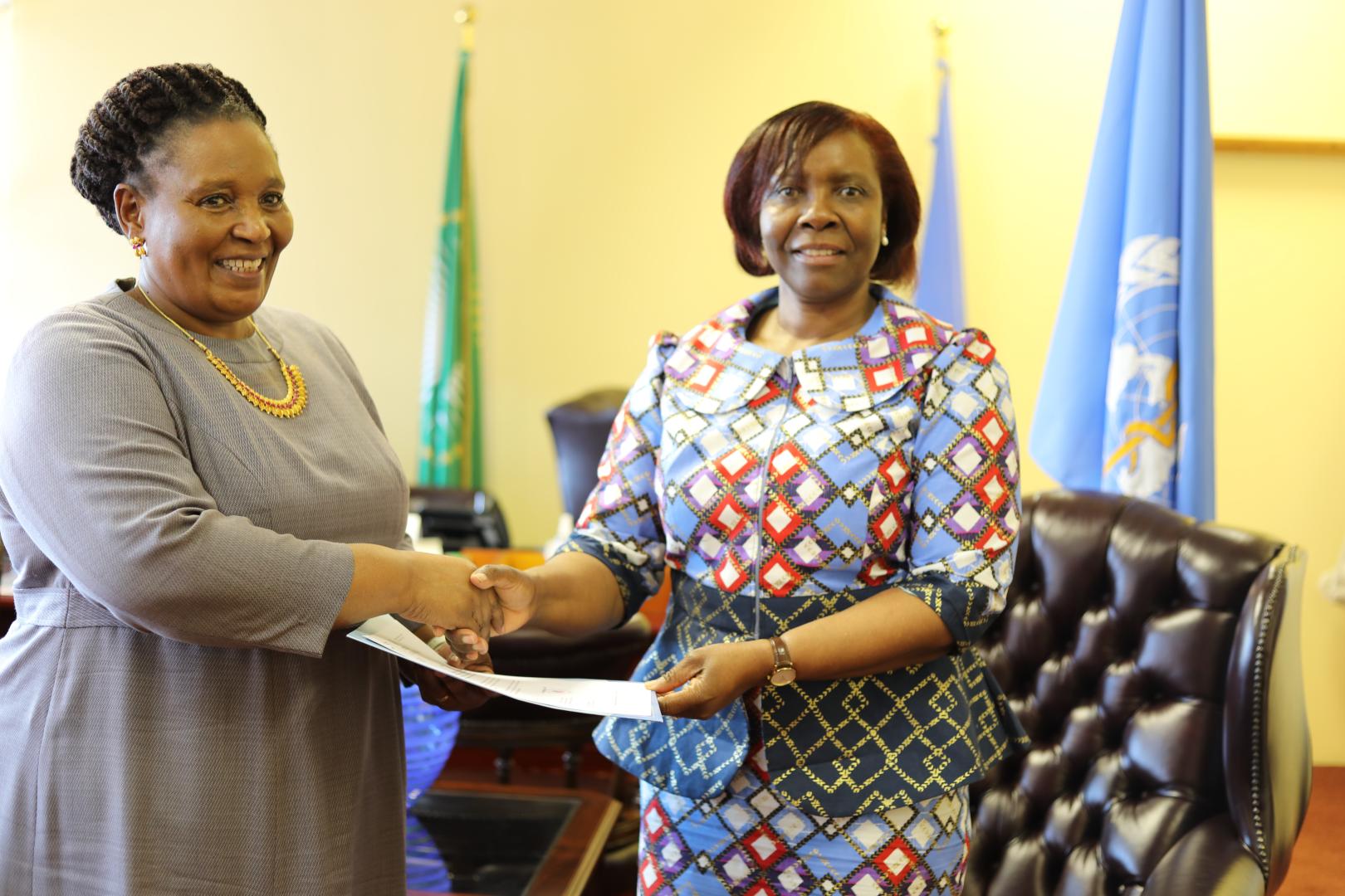 Minister of Foreign Affairs and International Relations Honorable Thuli Dhladhla receiving a letter of credence from the WHO Representative to Eswatini Dr Susan Tembo