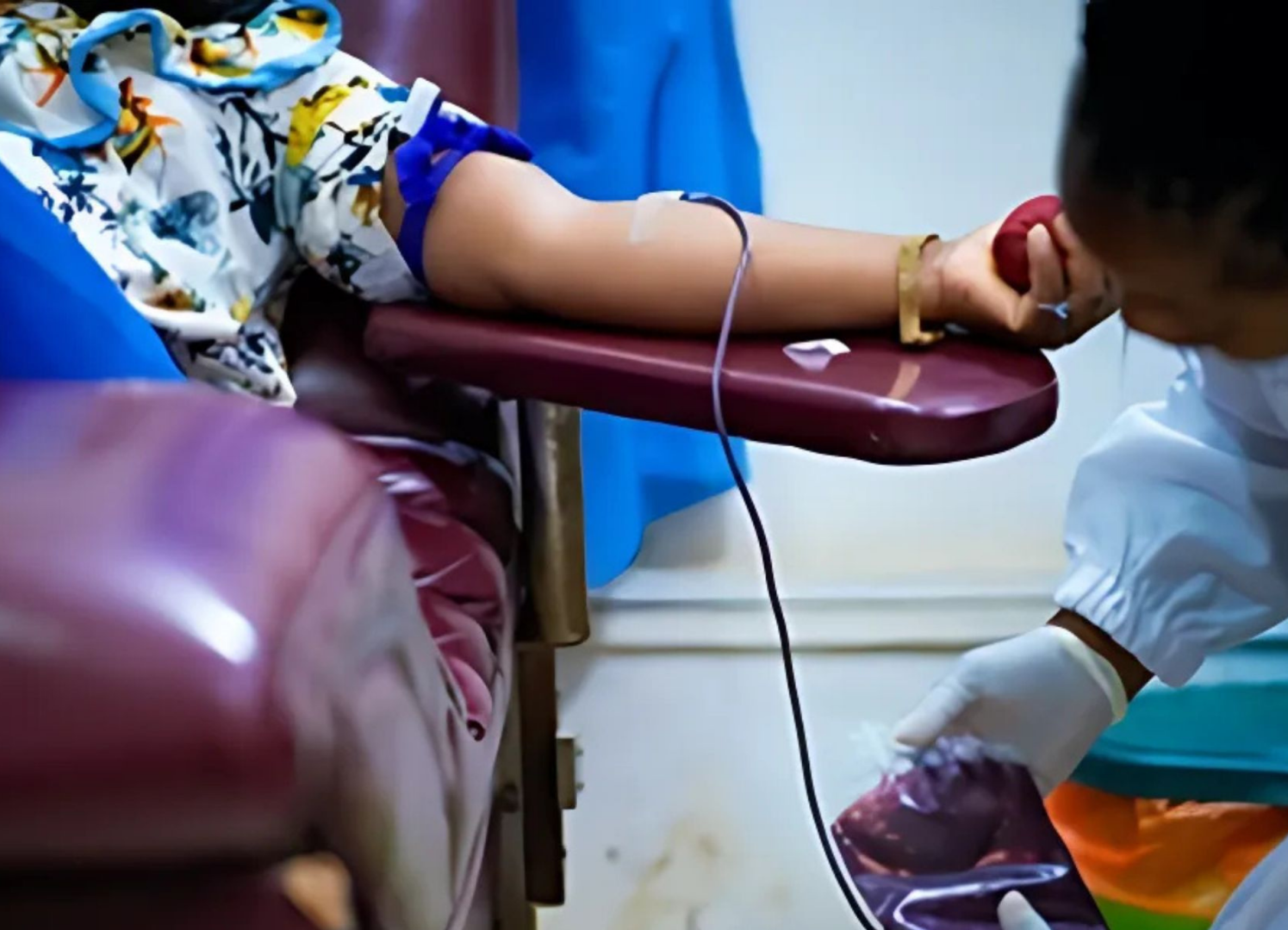 Woman donating blood.