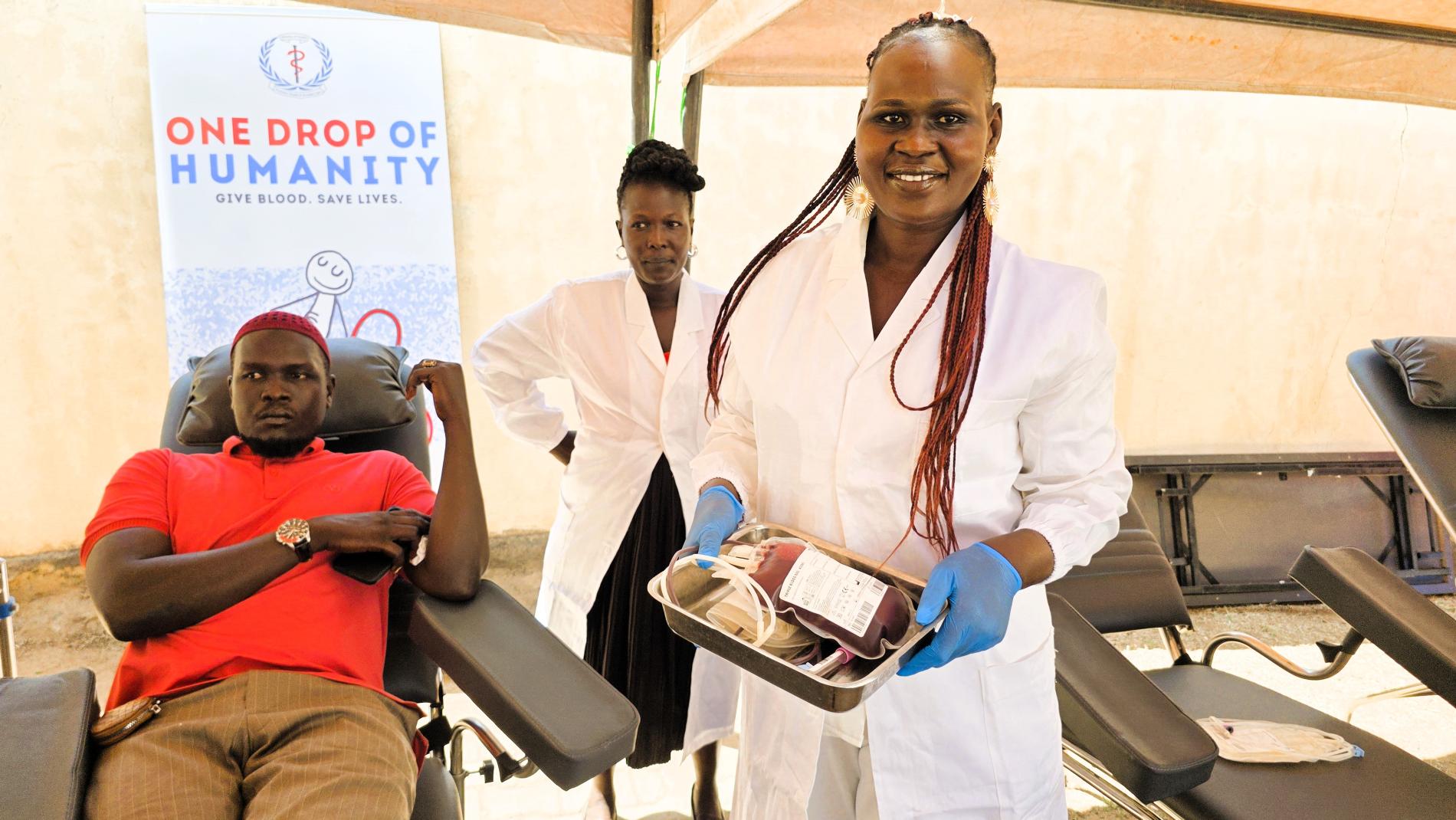 Healthcare workers collect blood from a donor during World Blood Donor Day 2026 in Juba