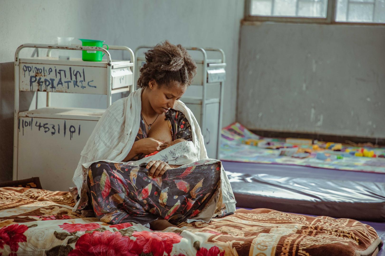 A mother breastfeeds her child in the nutrition stabilization center at Mehoni Primary Hospital.