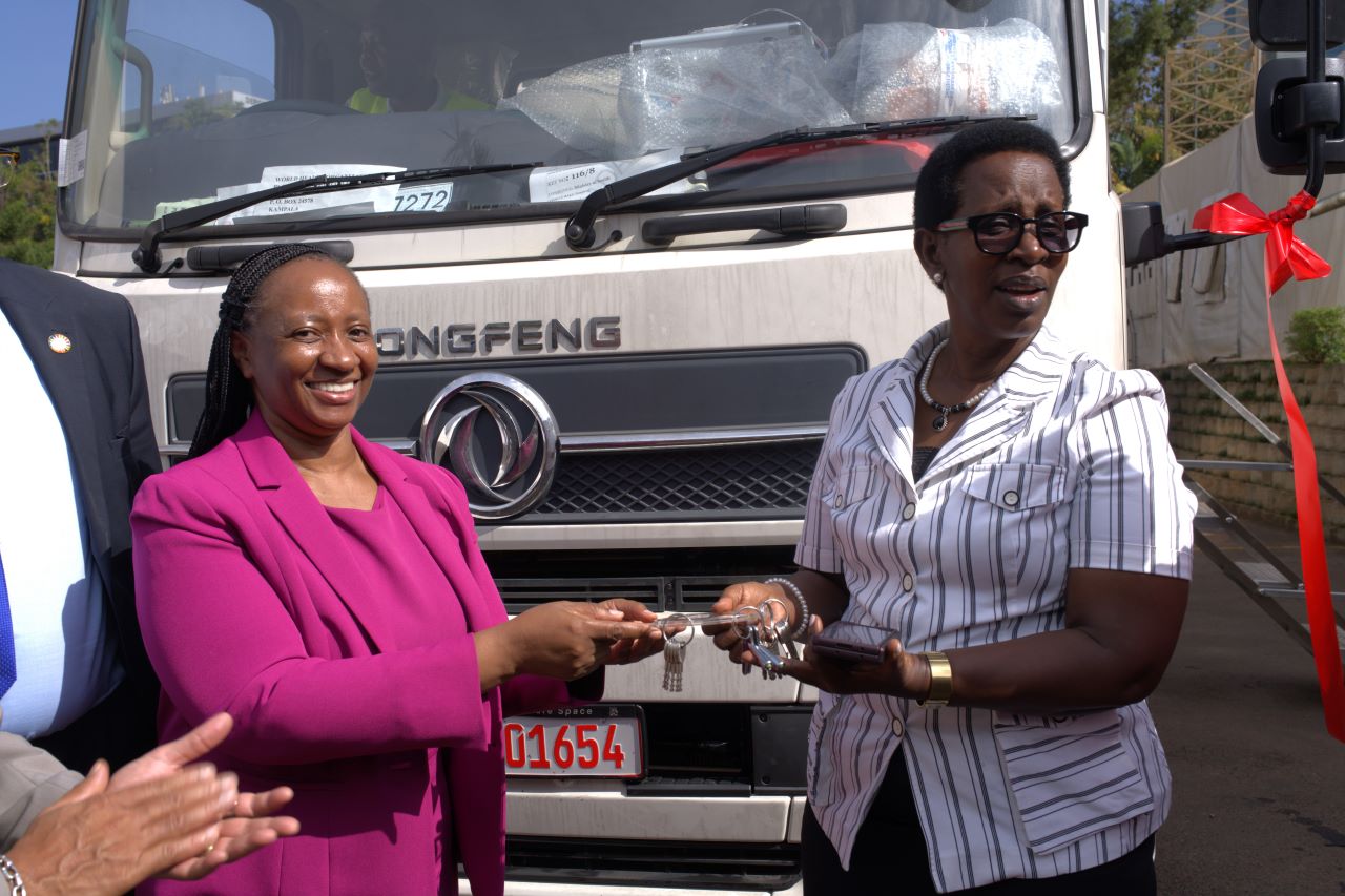 The WHO Representative to Uganda, Dr Kasonde Mwinga handing over the keys of the mobile laboratory to the Permanent Secretary at the Ministry of Health, Dr Diana Atwine.