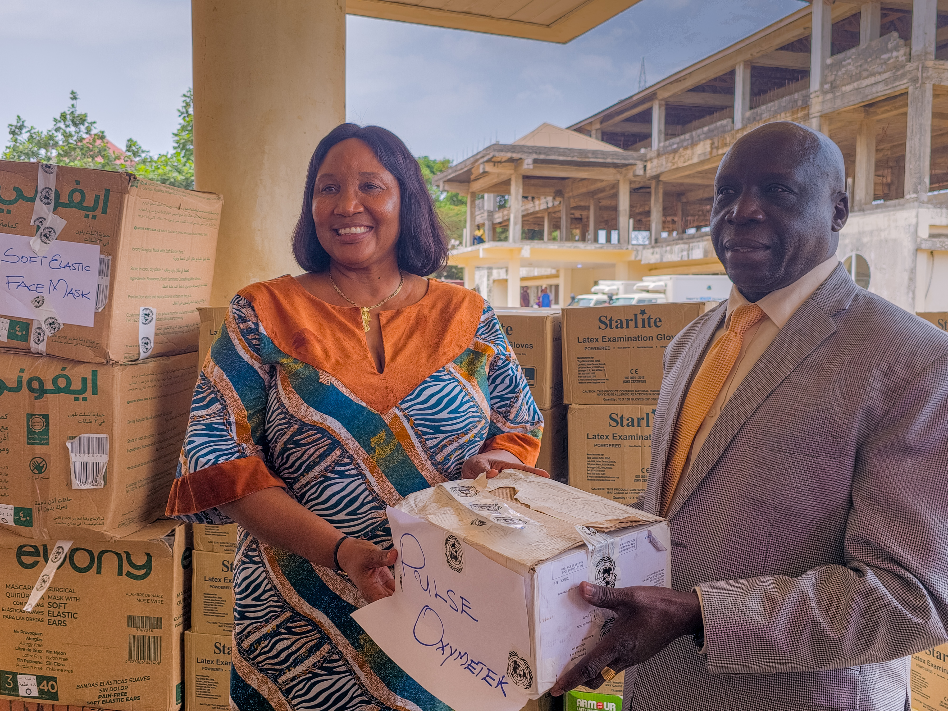 Dr. Peter Clement, WHO Country Representative in Liberia hands over medical supplies to the Hon. Min of Health Dr. Kpoto