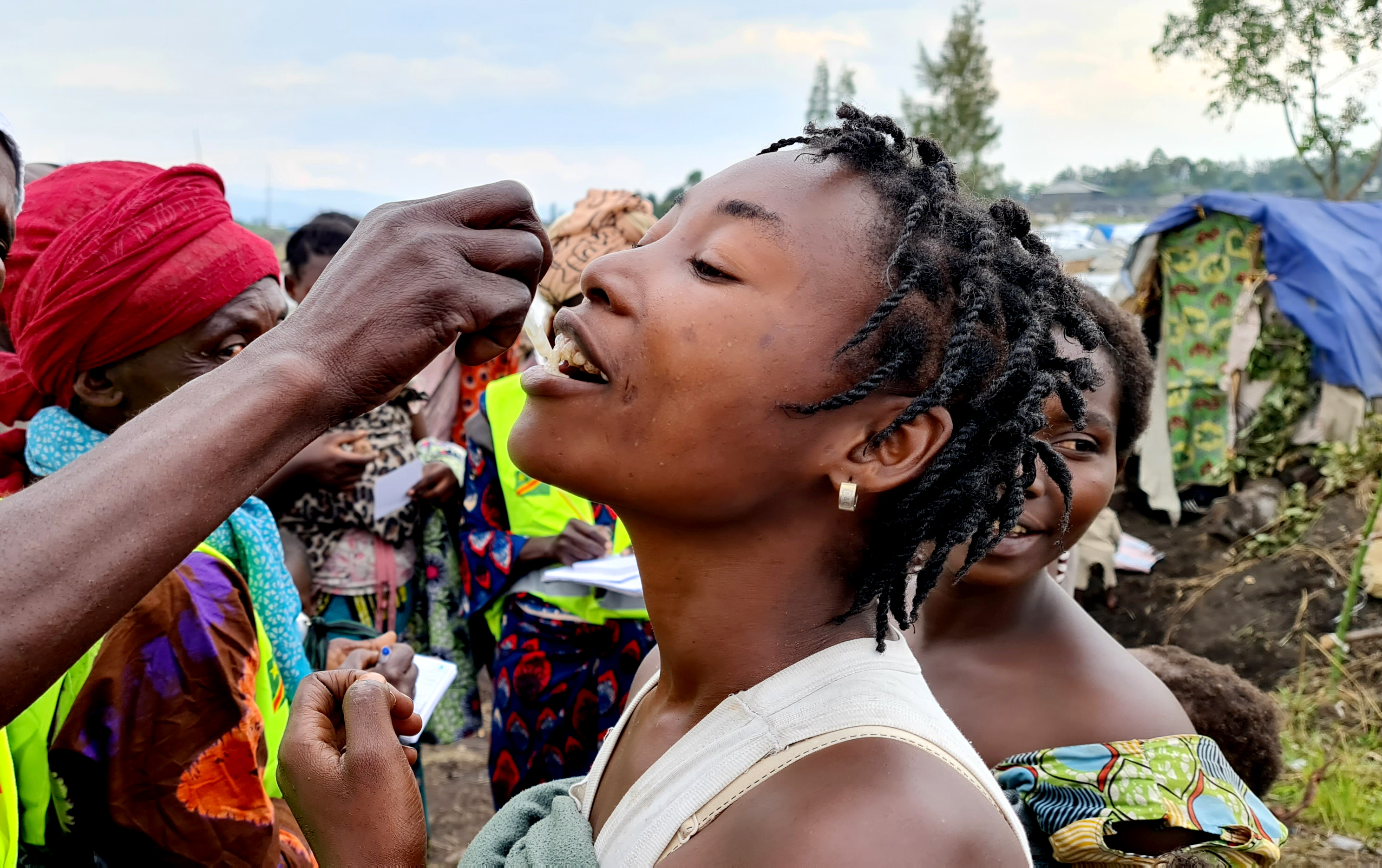 A woman receives a dose of the oral cholera vaccine, during a vaccination campaign in Bulengo camp for internally displaced people in January 2023. Credit: WHO / Eugène Kabambi Kabangu