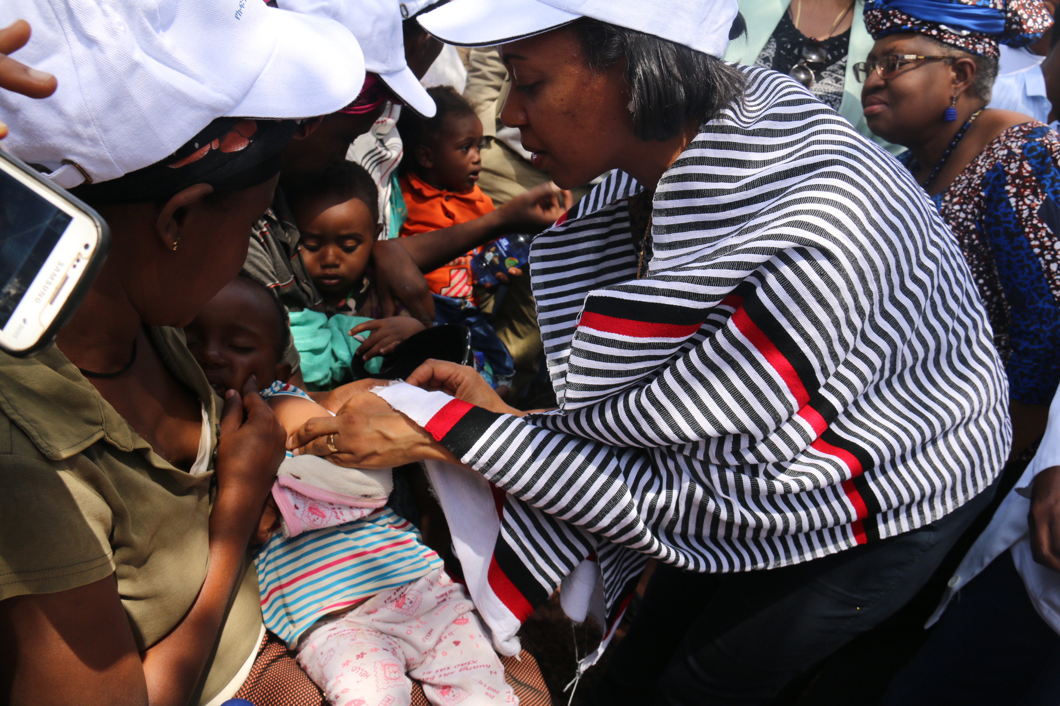 H.E. Dr Liya Tadesse, State Minister of Health vaccinating Measles second dose to a child during launching