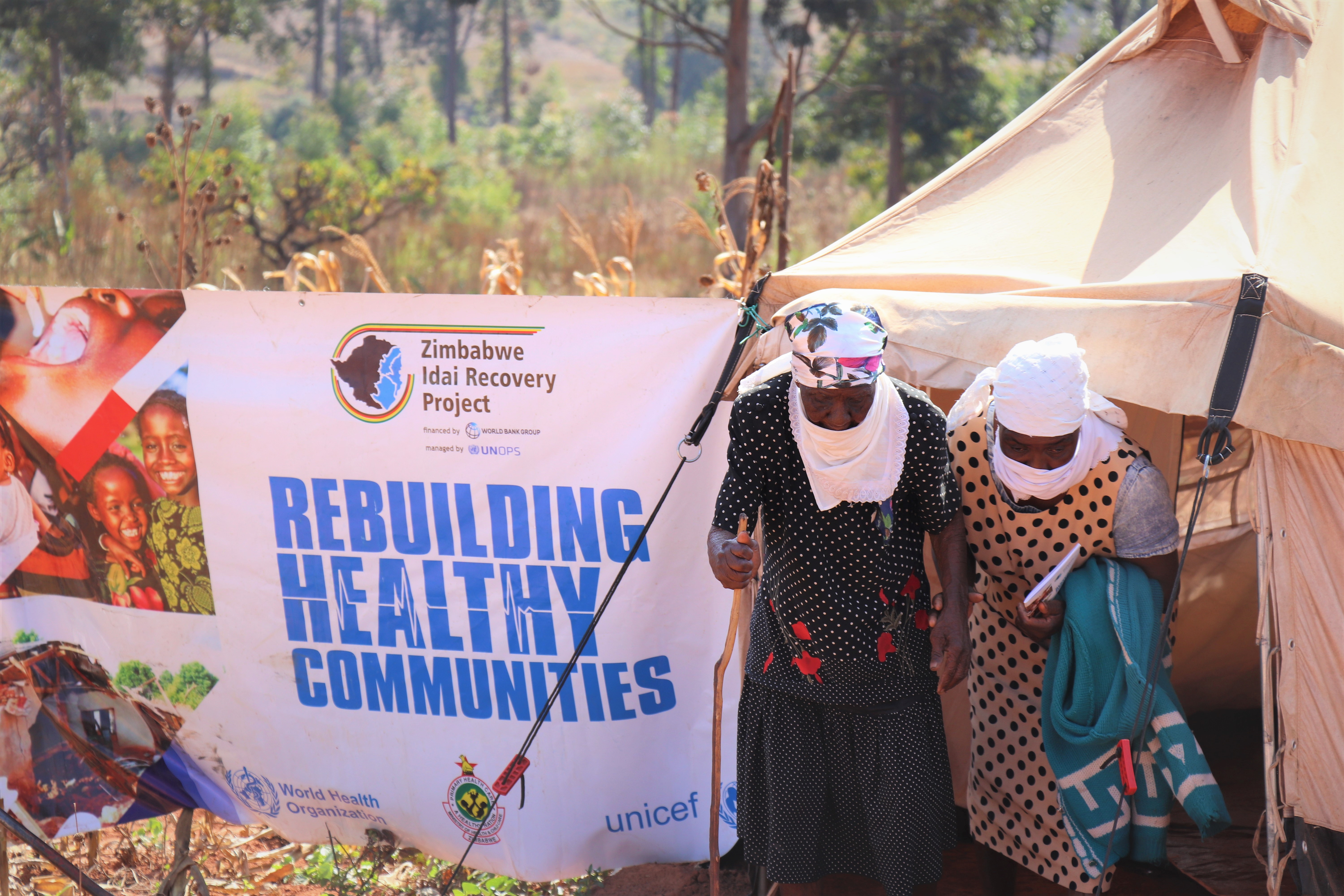 Garikai Camp Residents walking out of the mobile clinic consultation tent 